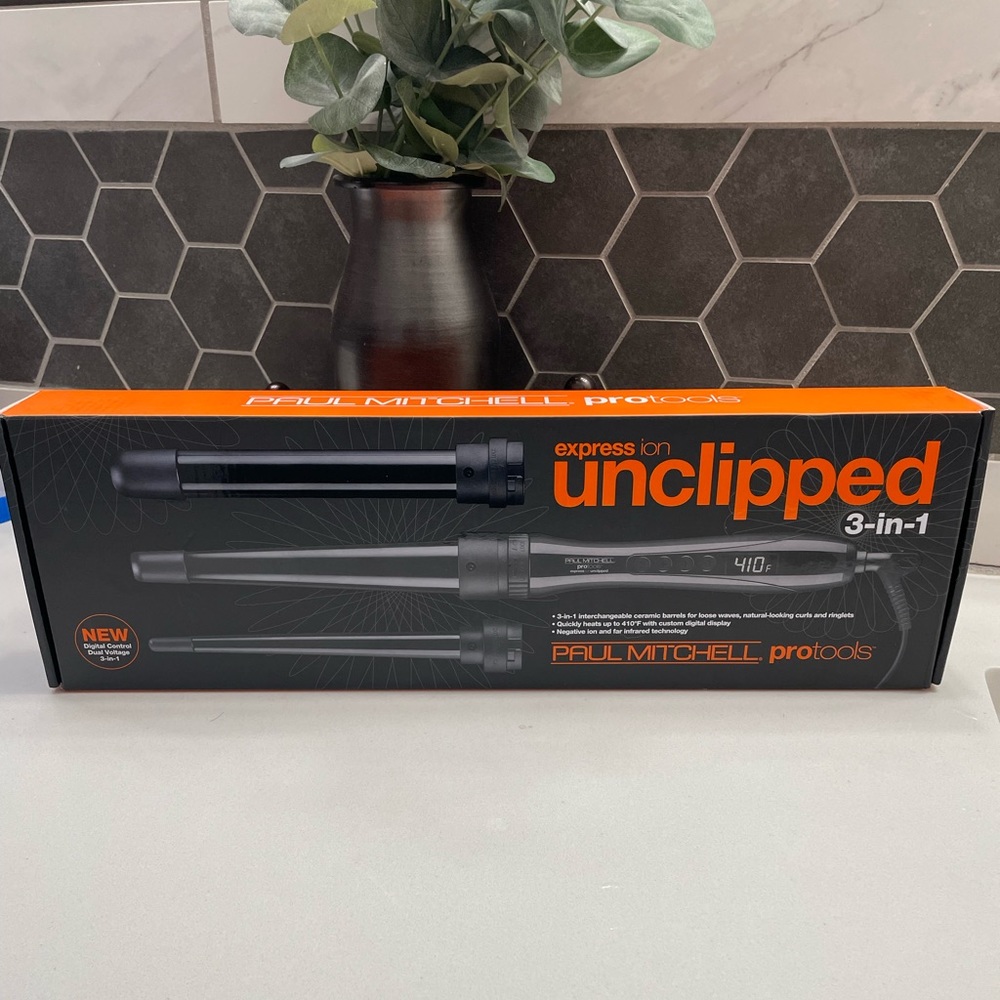 NIB never opened Paul Mitchell unclipped 3-in-1 wrapping iron set.